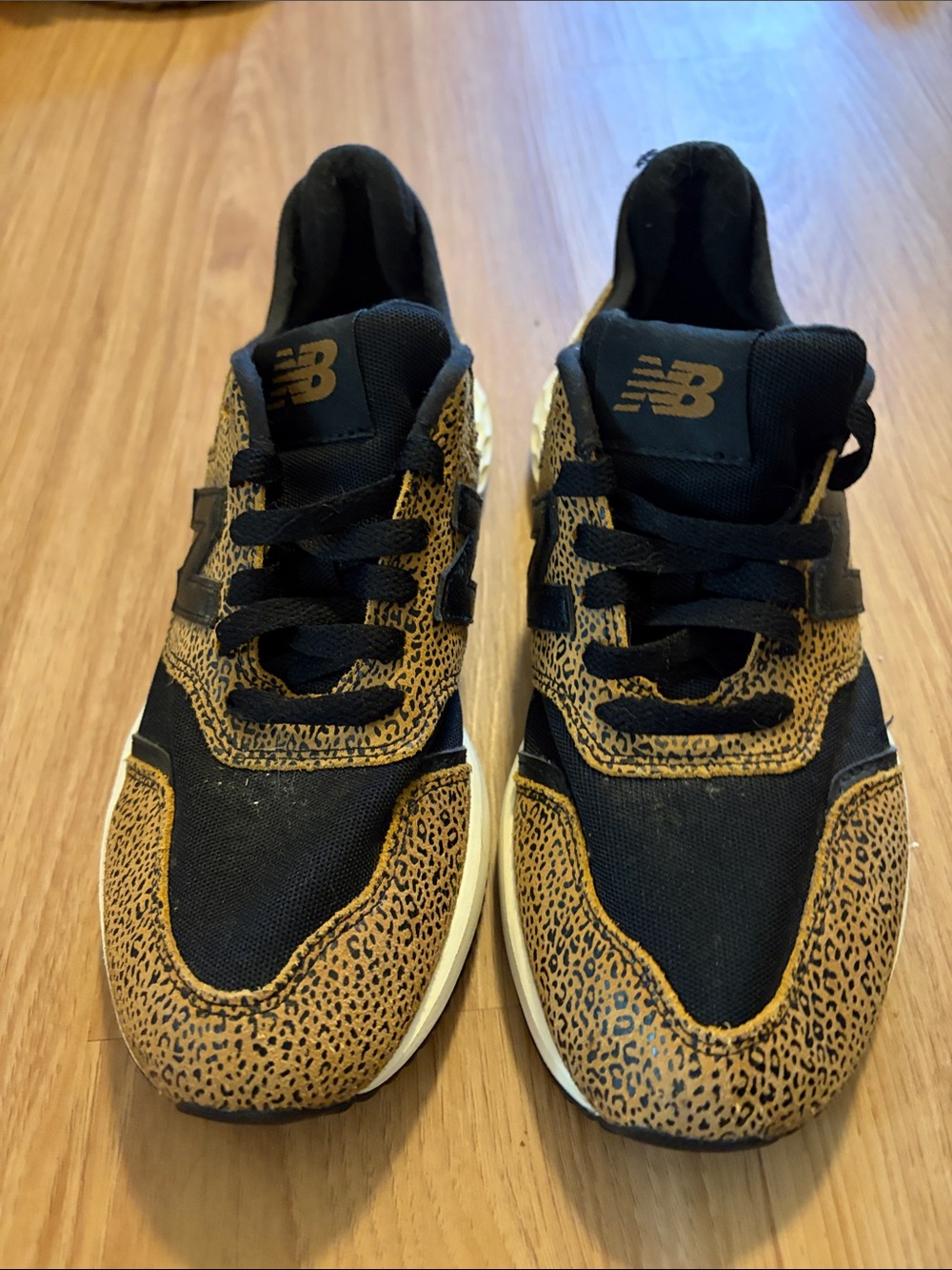 New Balance women’s Black and Tan Leopard-Print Sneakers